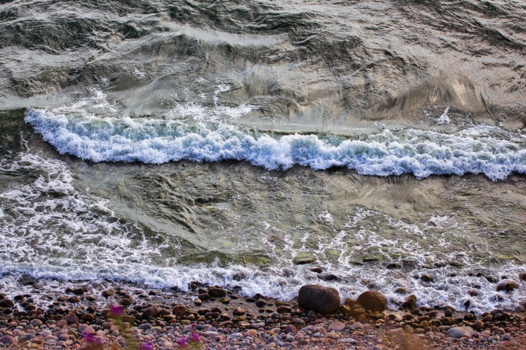 Ocean waves gently rolling onto shore